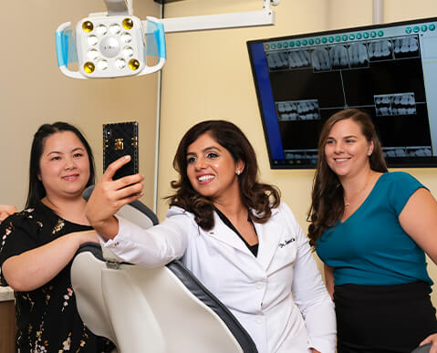 Highland Village Dental Studio team taking a selfie